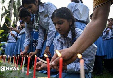Mourners and students light candles to offer their condolences after the death of mountaineer Nirmal Purja 