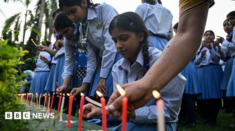Mourners and students light candles to offer their condolences after the death of mountaineer Nirmal Purja