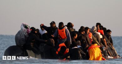 A group of migrants on a dingy off the coast of Gravelines, in a grab from the BBC video.