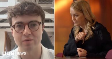 Jacob Coxon, shown on the left, wearing dark frame glasses and a white collored shirt. On the right is BBC's Laura Kuenssberg in a black shirt sitting with her arms on a desk as she looks to the left of frame.