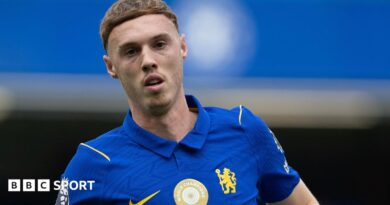 Chelsea forward Cole Palmer, wearing, the club's blue home kit, looks at the camera during a Premier League match