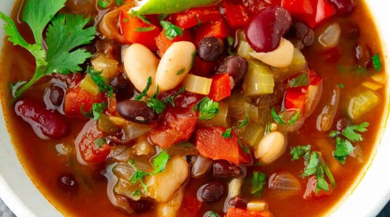 Three bean soup in a white bowl.