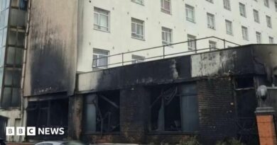 The front of a hotel damaged by fire.