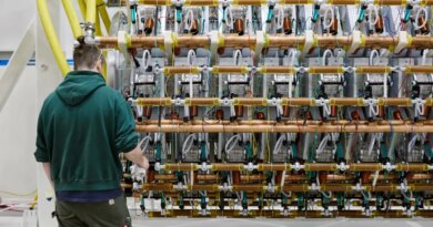 A man works on Pacific Fusion's pulser prototype.