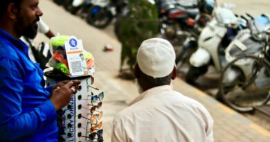 phonepe UPI being used to accept payments at a road-side sunglasses stall.
