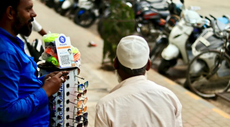 phonepe UPI being used to accept payments at a road-side sunglasses stall.