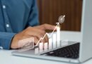 Businessman tracking corporate growth and hitting financial business targets on a laptop