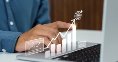 Businessman tracking corporate growth and hitting financial business targets on a laptop