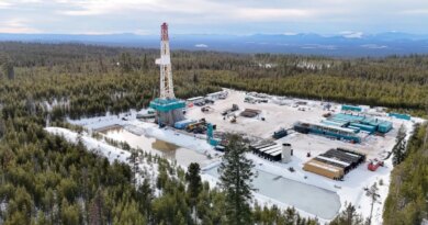 A geothermal drilling rig sits in a forest in Oregon.