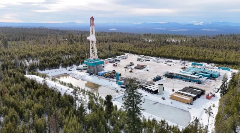 A geothermal drilling rig sits in a forest in Oregon.
