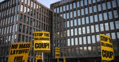 Demonstrators gather outside of the Office of Personnel Management in Washington, D.C. on February 7, 2025 to protest federal layoffs and demand the termination of Elon Musk from the Department of Government Efficiency (DOGE). (Photo by Bryan Dozier / Middle East Images / Middle East Images via AFP)