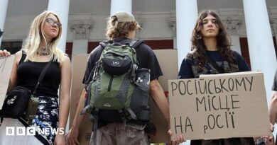 Activists holding placards take part in a rally in support of introducing a moratorium on the public use of Russian-language cultural products on July 8, 2026 in Odesa, Ukraine