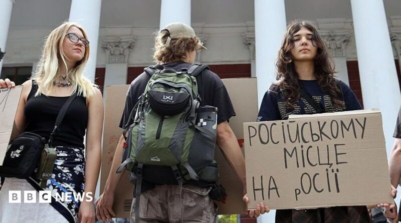 Activists holding placards take part in a rally in support of introducing a moratorium on the public use of Russian-language cultural products on July 8, 2026 in Odesa, Ukraine