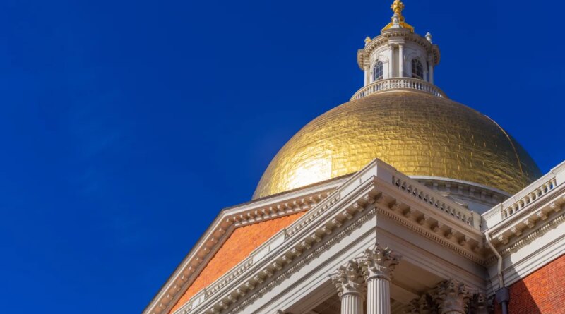 The gold dome of the Massachusetts State House stands against a blue sky.