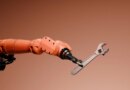 Conceptual image of a robotic arm holding a wrench.