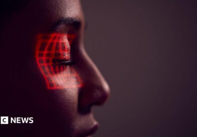 Facial Recognition Technology Concept As Woman Has Red Grid Projected Onto Eye In Studio