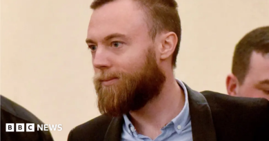 Jack Shepherd in court. He wears a shirt and jacket and has a beard