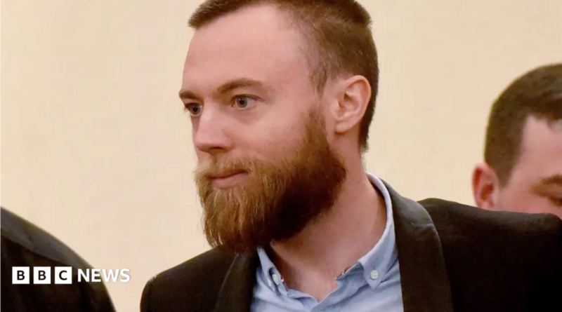 Jack Shepherd in court. He wears a shirt and jacket and has a beard
