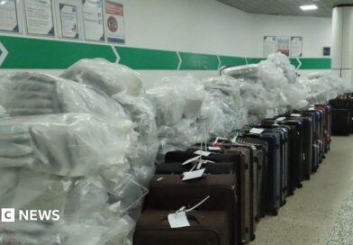 Large bags of cannabis next to a row of suitcases in an airport