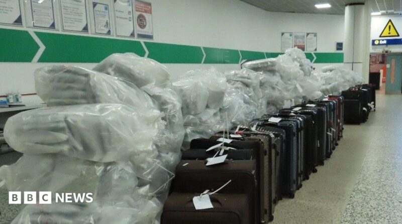 Large bags of cannabis next to a row of suitcases in an airport
