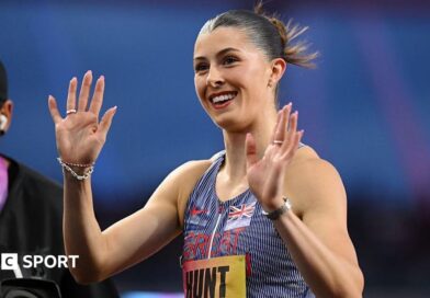 Amy Hunt smiles and waves after the 200m at the Ultimate Championship