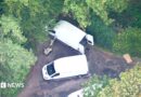 Aerial footage of robot and white vans near RAF Fairford