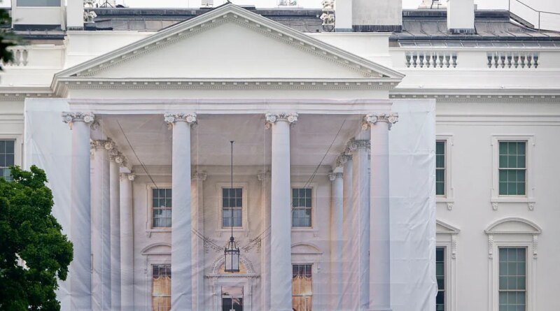 A protective tarp with a photo on it covers the scaffolding and the columns on the North Portico of the White House on July 18, 2026 in Washington, DC..