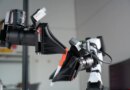 XDOF's robotic arms manipulate a pen and cap.