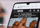 Asos website on smartphone screen.