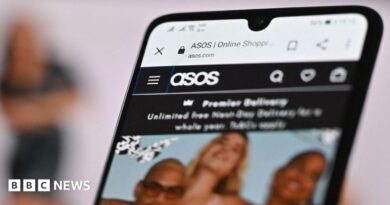 Asos website on smartphone screen.