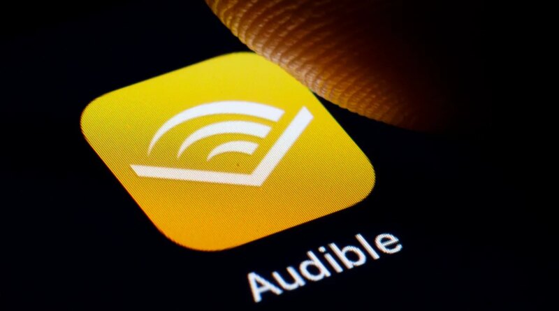 In this photo illustration the logo of Amazon Audible is displayed on a smartphone