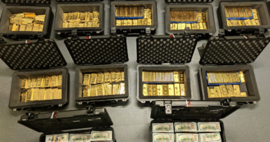 nine suitcases full of gold bars, and two suitcases full of 100-dollar cash bills, as a photo taken from above.