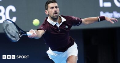 Novak Djokovic stretches to hit a forehand stroke during his quarter-final victory over Alexander Zverev