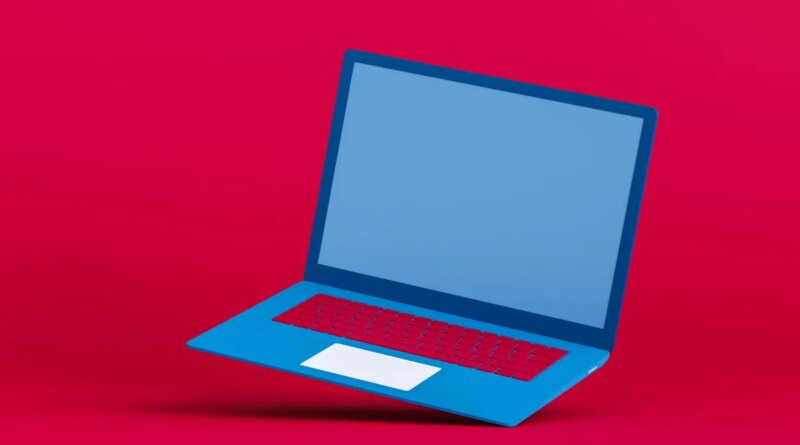 Blue laptop on a red background