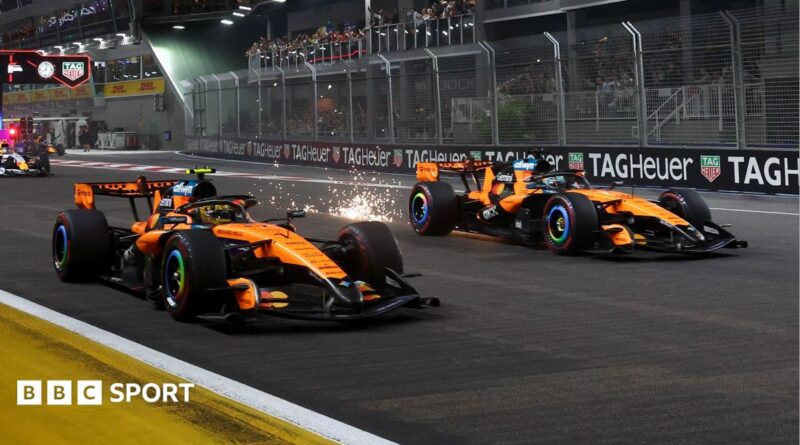 Lando Norris and Oscar Piastri move away at the start of the Singapore Grand Prix