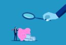 render of hand holding magnifying glass to examine piggy bank.