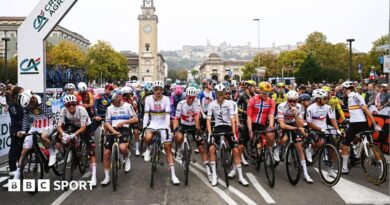 Riders at the Giro di Lombardia stage a protest prior to the start of the race