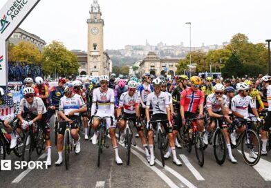 Riders at the Giro di Lombardia stage a protest prior to the start of the race