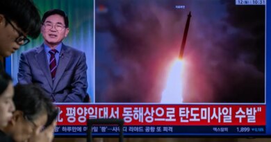 TOPSHOT - News coverage showing file footage of a North Korean missile launch is seen on a screen at Seoul Station in Seoul on October 12, 2026. North Korea on October 12 fired multiple ballistic missiles off its east coast, Seoul's military said, after weeks of mounting friction over a landmine explosion along the countries' heavily fortified border. (Photo by Philip FONG / AFP via Getty Images)