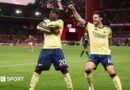 Noni Madueke celebrates with Declan Rice.