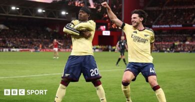 Noni Madueke celebrates with Declan Rice.