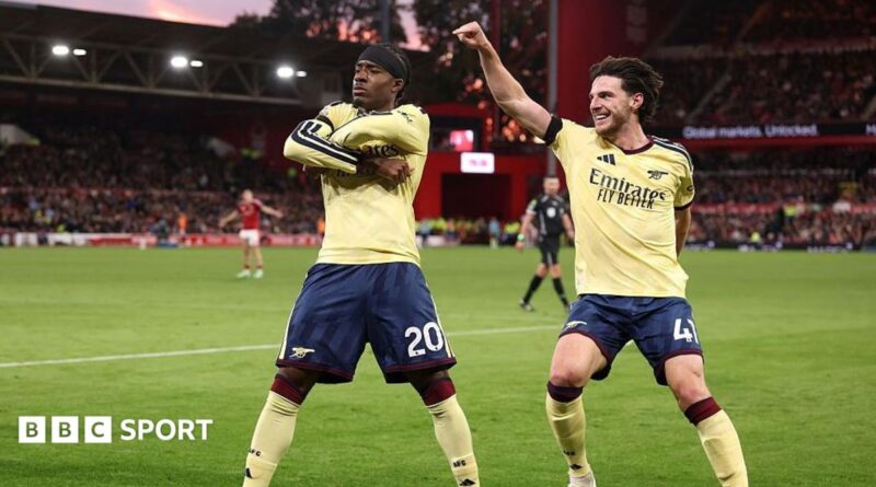 Noni Madueke celebrates with Declan Rice.