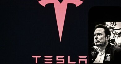 In this photo illustration, Tesla logo is seen on a screen, while an image of Tesla CEO Elon Musk is displayed on a mobile phone