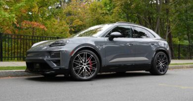 A Porsche Macan Turbo sits parked on the street.