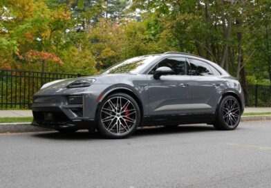 A Porsche Macan Turbo sits parked on the street.