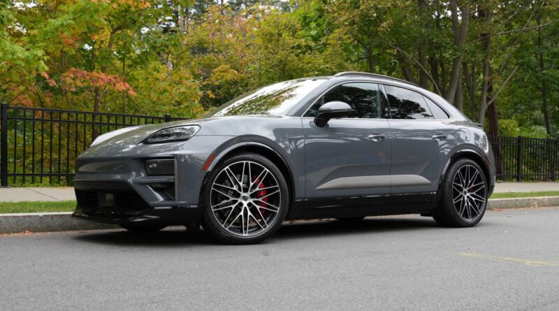 A Porsche Macan Turbo sits parked on the street.
