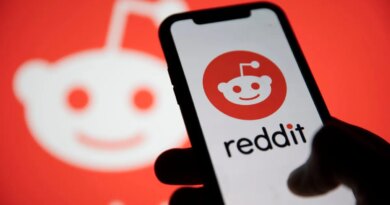 Reddit logo displayed on smartphone with Reddit logo in the background