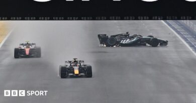 The Mercedes of George Russell spins on the start-finish straight as Red Bull's Max Verstappen and Ferrari's Lewis Hamilton go past during the Singapore Grand Prix sprint race