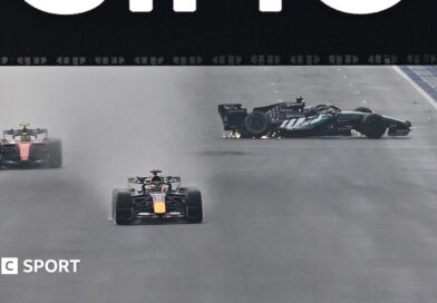 The Mercedes of George Russell spins on the start-finish straight as Red Bull's Max Verstappen and Ferrari's Lewis Hamilton go past during the Singapore Grand Prix sprint race