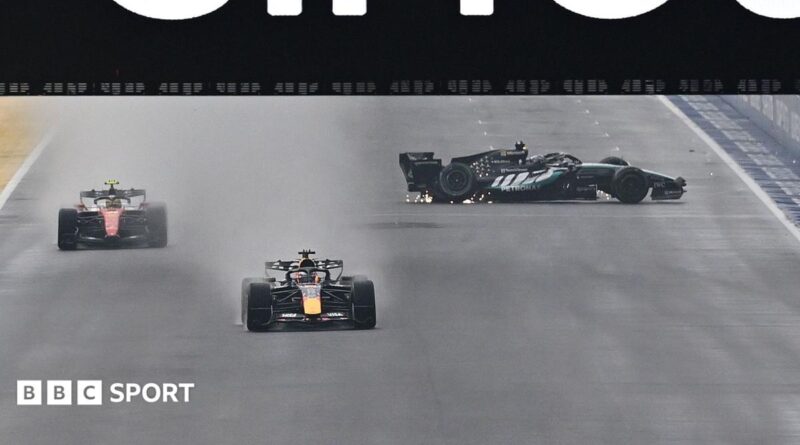 The Mercedes of George Russell spins on the start-finish straight as Red Bull's Max Verstappen and Ferrari's Lewis Hamilton go past during the Singapore Grand Prix sprint race